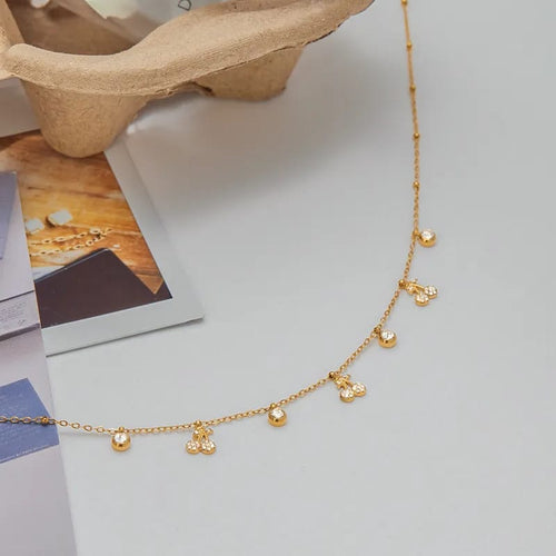 Crystal cherry charm necklace on magazine styled shot