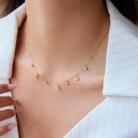 Crystal cherry charm necklace worn by model
