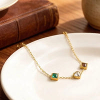 Multi-colour gemstone bracelet on white plate