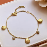 Gold shell charm bracelet styling shot