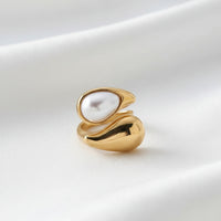 Gold teardrop open ring pearl and tiger eye clean product shot